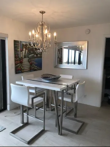 a room with furniture and painting on the wall