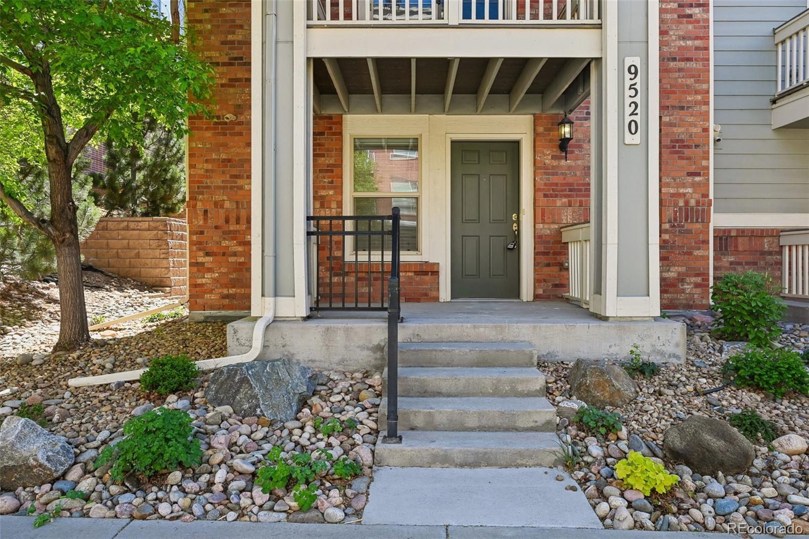9520 Halstead Lane Lone Tree, CO 80124 - Photo 2 of 29 a front view of a house with a garden