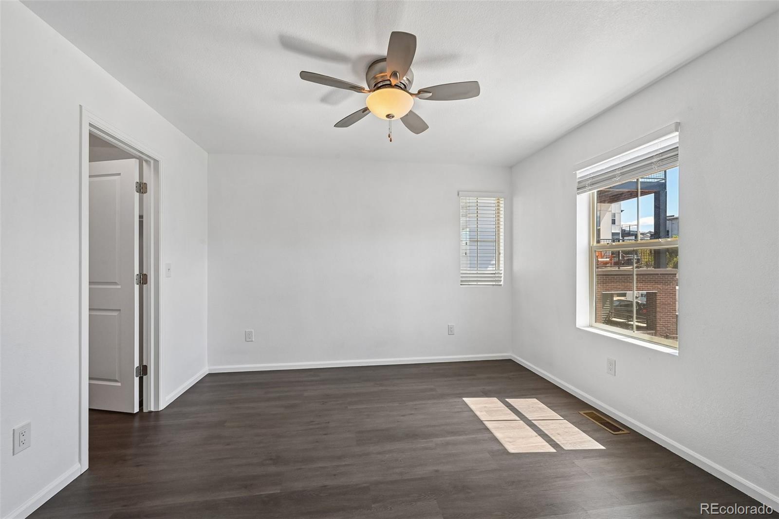 9520 Halstead Lane Lone Tree, CO 80124 - Photo 22 of 29 wooden floor in an empty room with a window