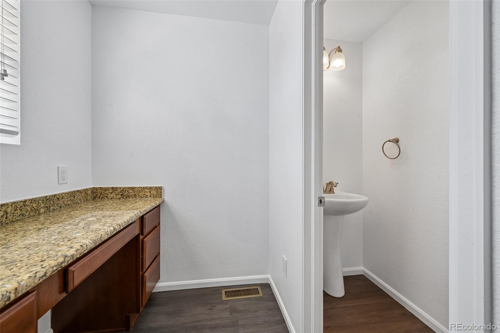9520 Halstead Lane Lone Tree, CO 80124 - Photo 24 of 29 an empty room with wooden floor