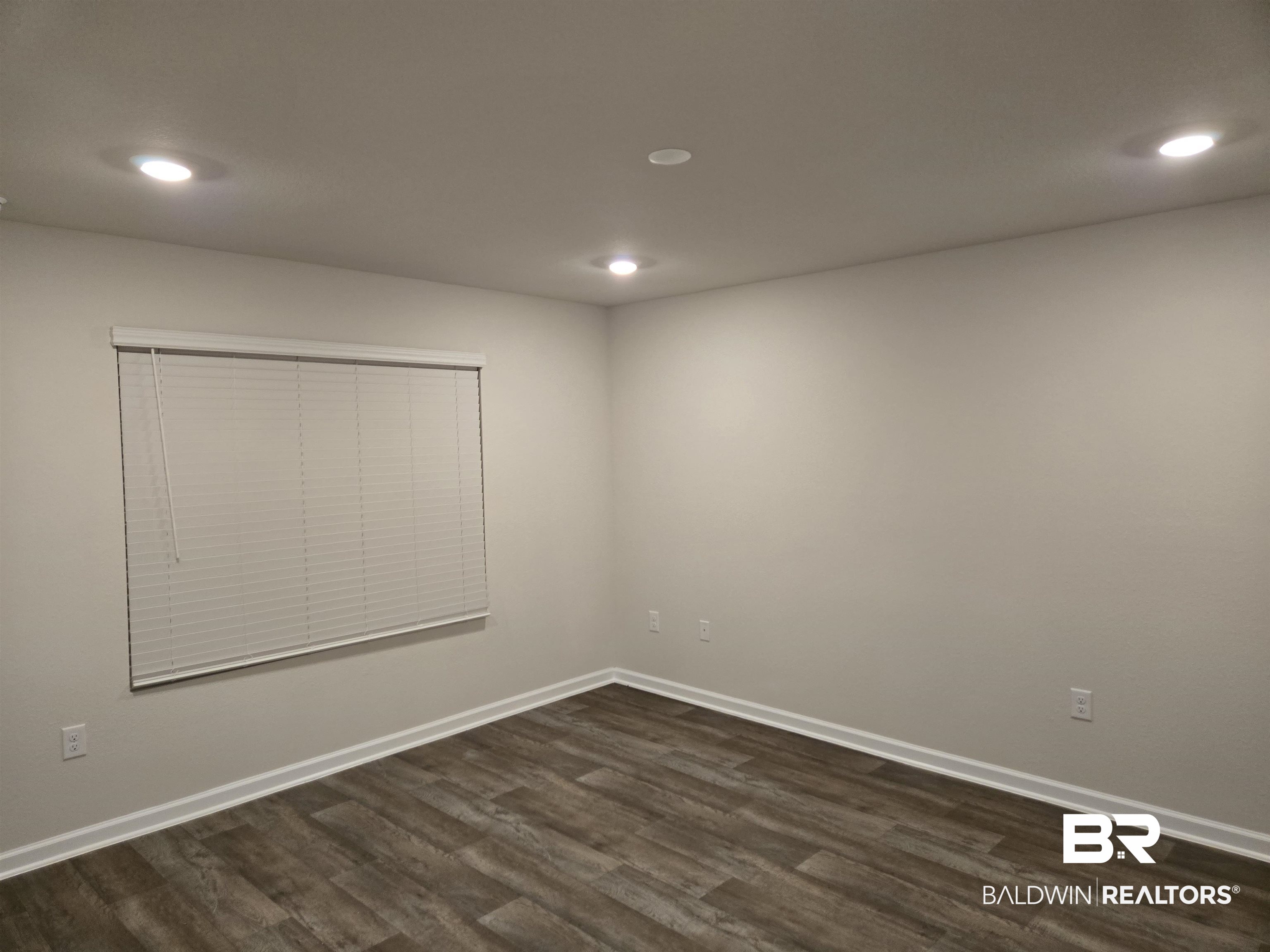 24194 Veranda Circle Elberta, AL 36530 - Photo 22 of 31 Spare room featuring dark wood-type flooring