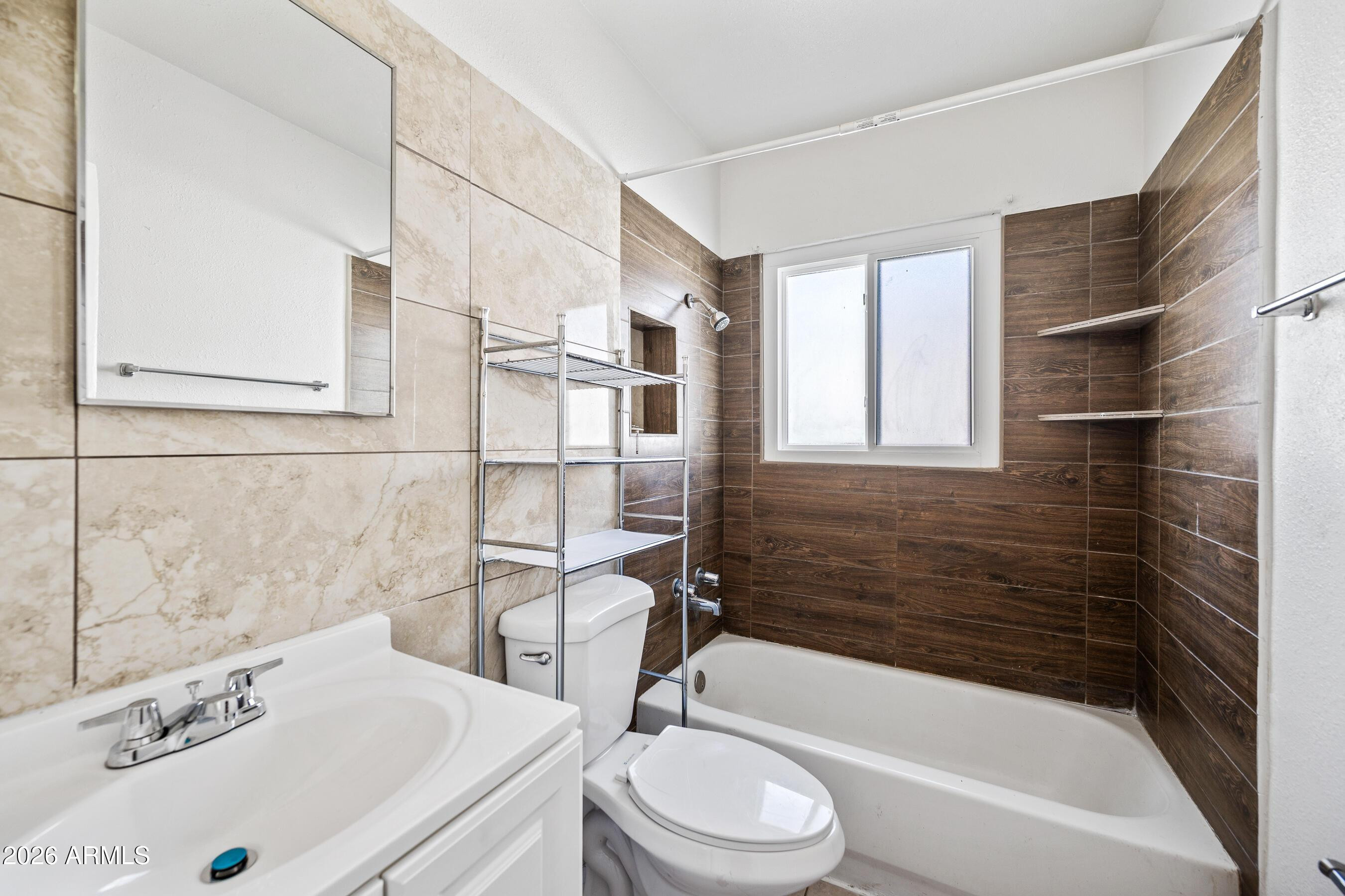 3903 North 12th Street Phoenix, AZ 85014 - Photo 13 of 16 a bathroom with a sink a toilet and bathtub