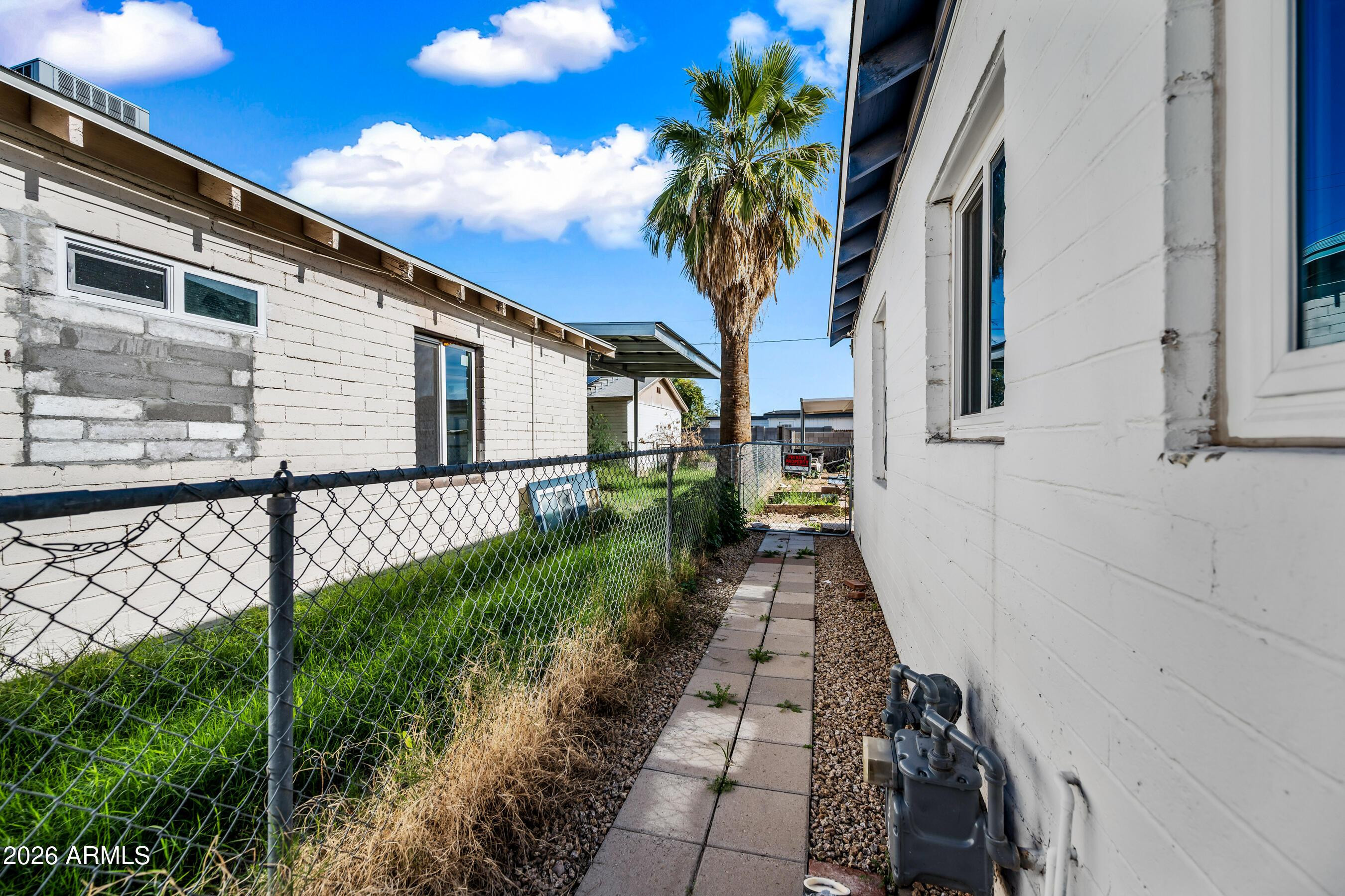 3903 North 12th Street Phoenix, AZ 85014 - Photo 15 of 16 a couple of flower plants in front of house