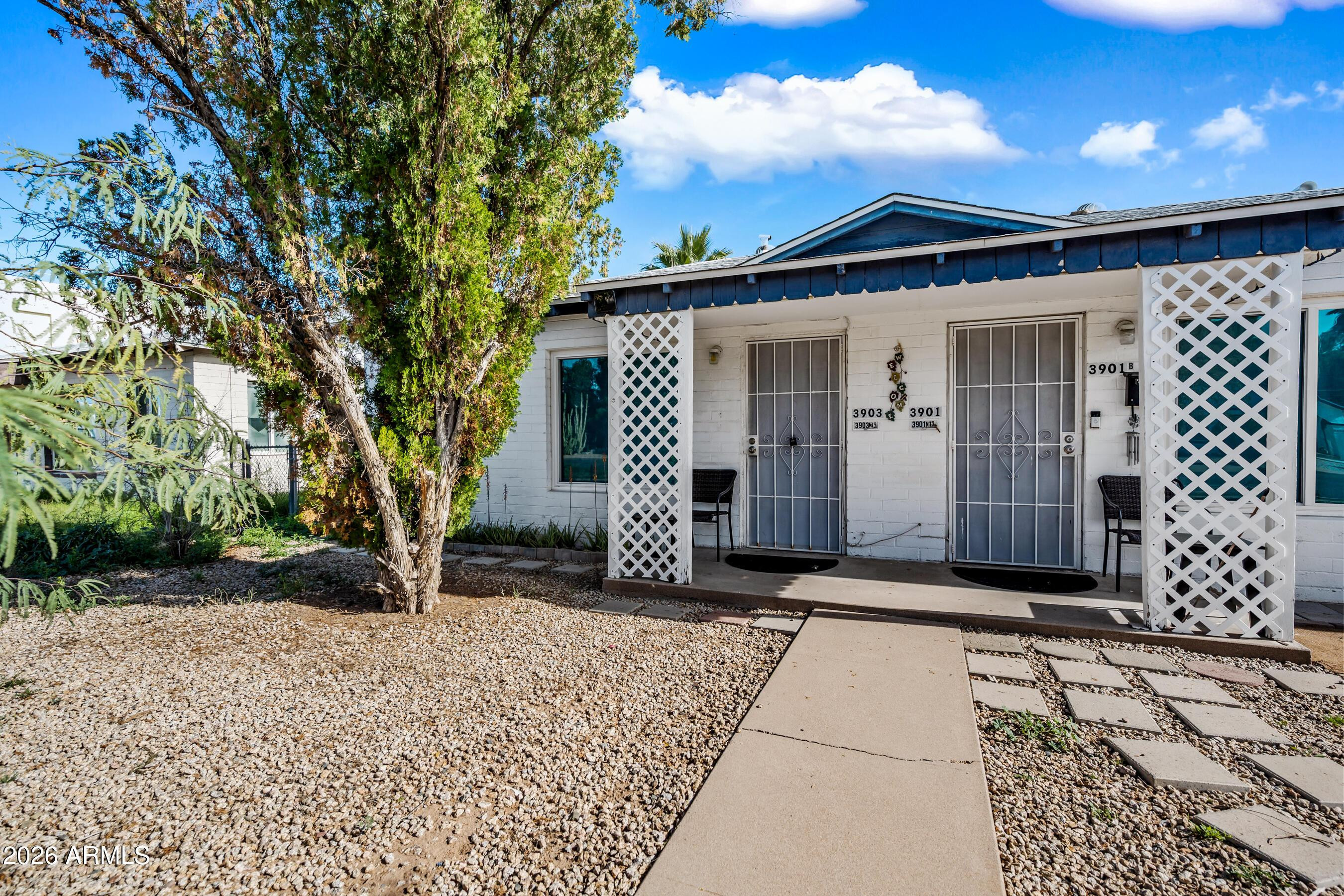 3903 North 12th Street Phoenix, AZ 85014 - Photo 2 of 16 a front view of a house with a yard