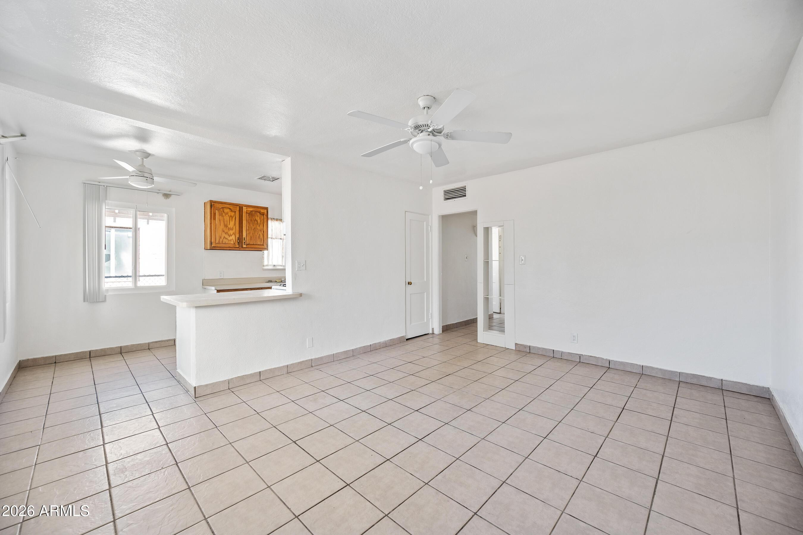 3903 North 12th Street Phoenix, AZ 85014 - Photo 3 of 16 a view of an empty room and window