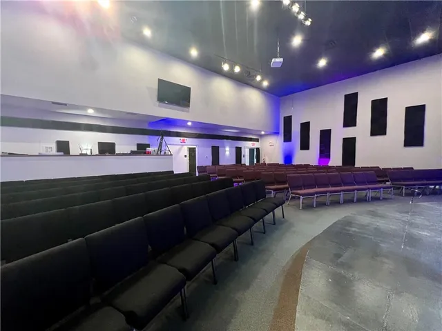 a living room with lots of furniture and a flat screen tv