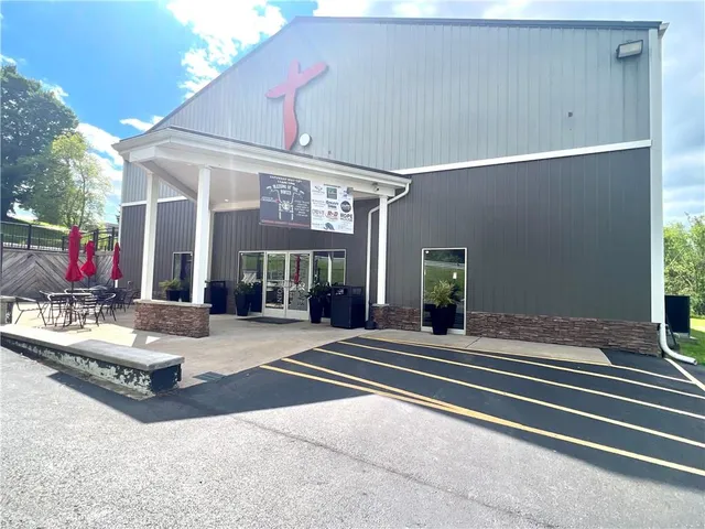 a view of a building with sitting area