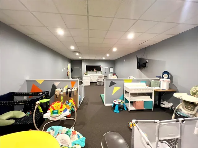 a room with lots of furniture and view kitchen