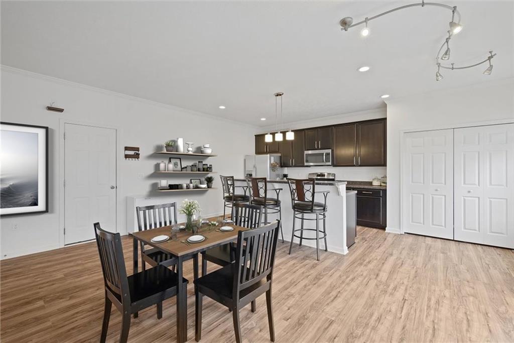 232 Foxwood Road Coraopolis, PA 15108 - Photo 8 of 25 a view of a dining room with furniture and wooden floor