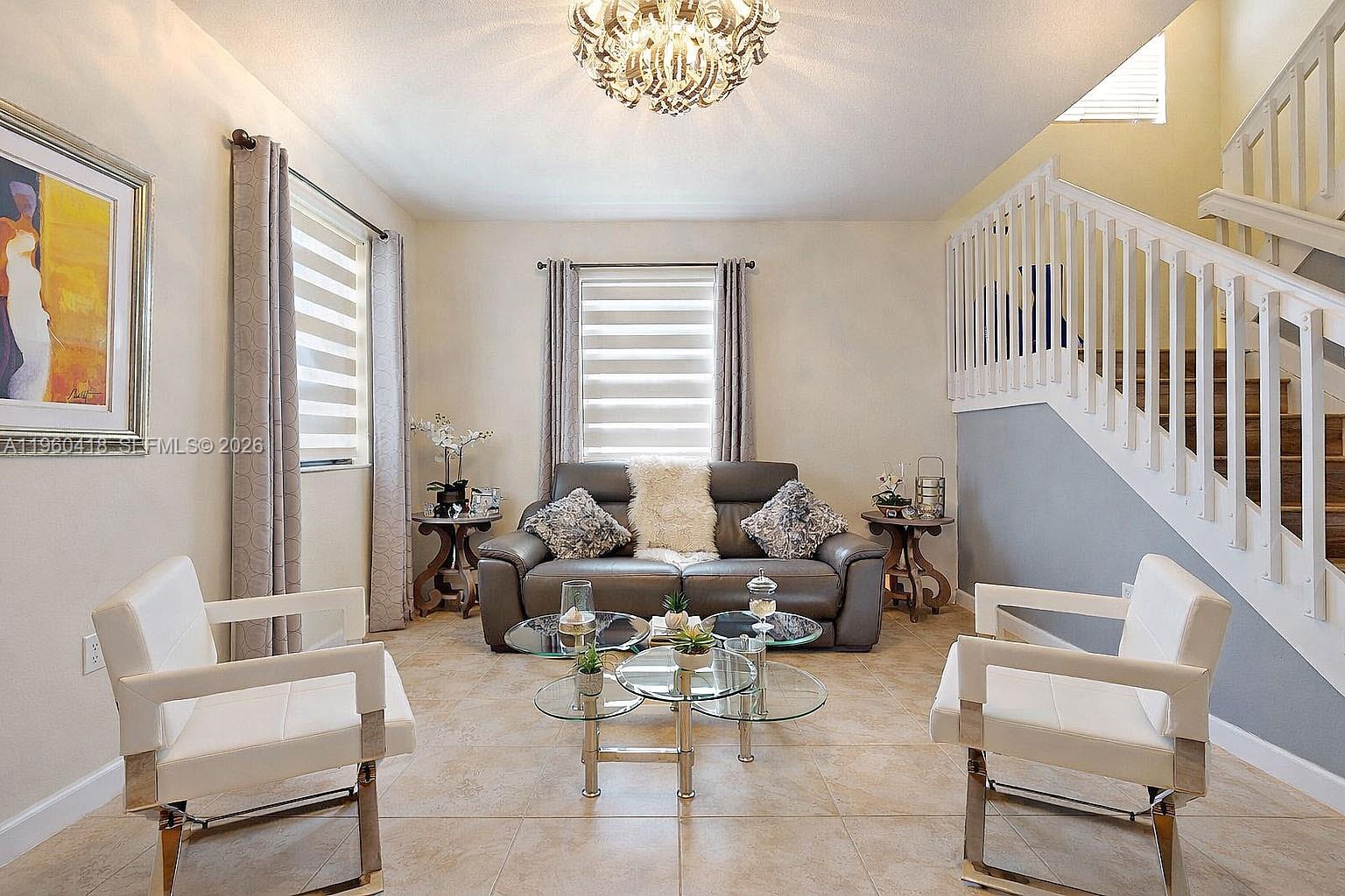 132 Northeast 26th Avenue Homestead, FL 33033 - Photo 11 of 68 a living room with furniture and a large window