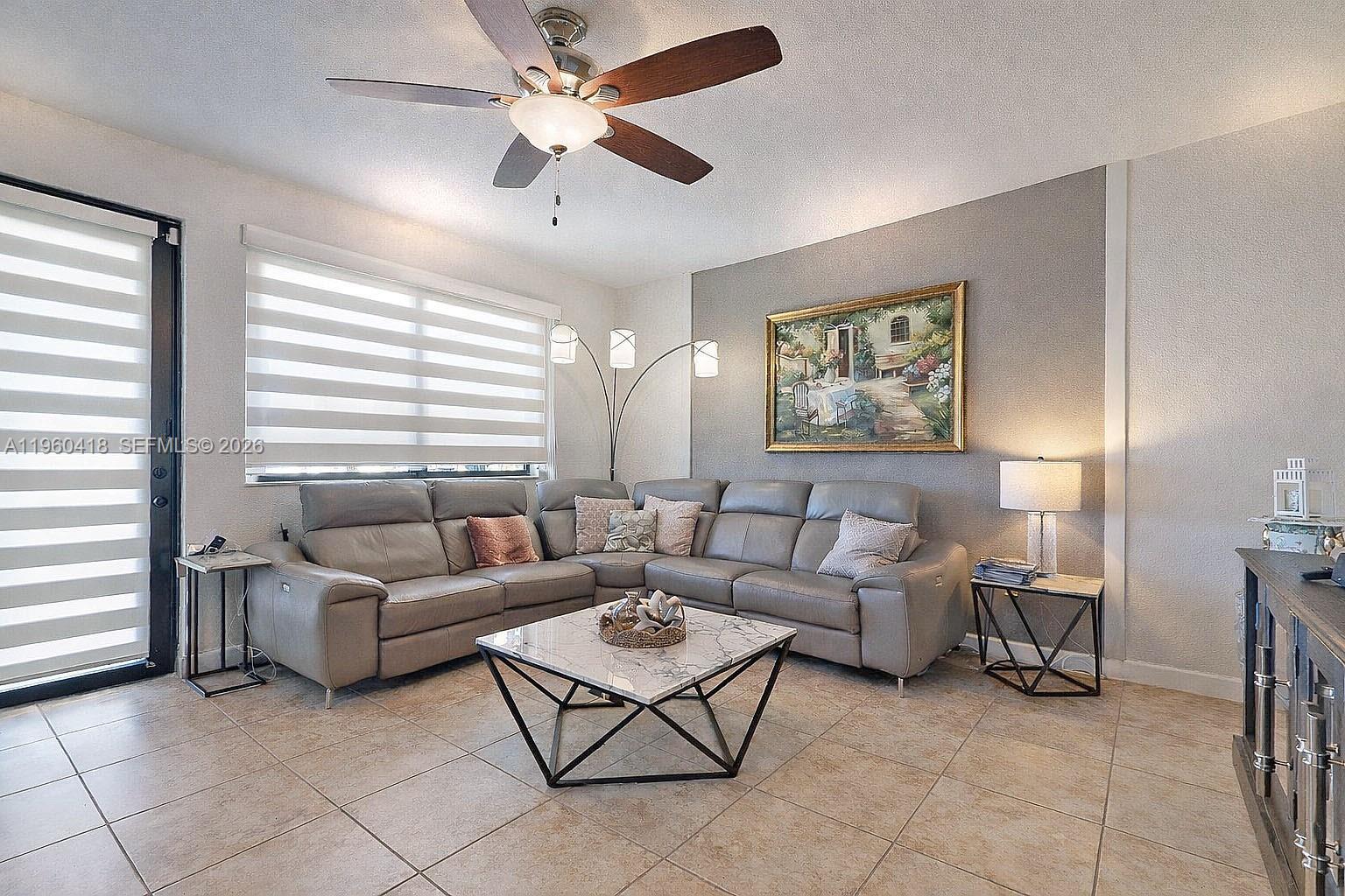 132 Northeast 26th Avenue Homestead, FL 33033 - Photo 24 of 68 a living room with furniture and a large window