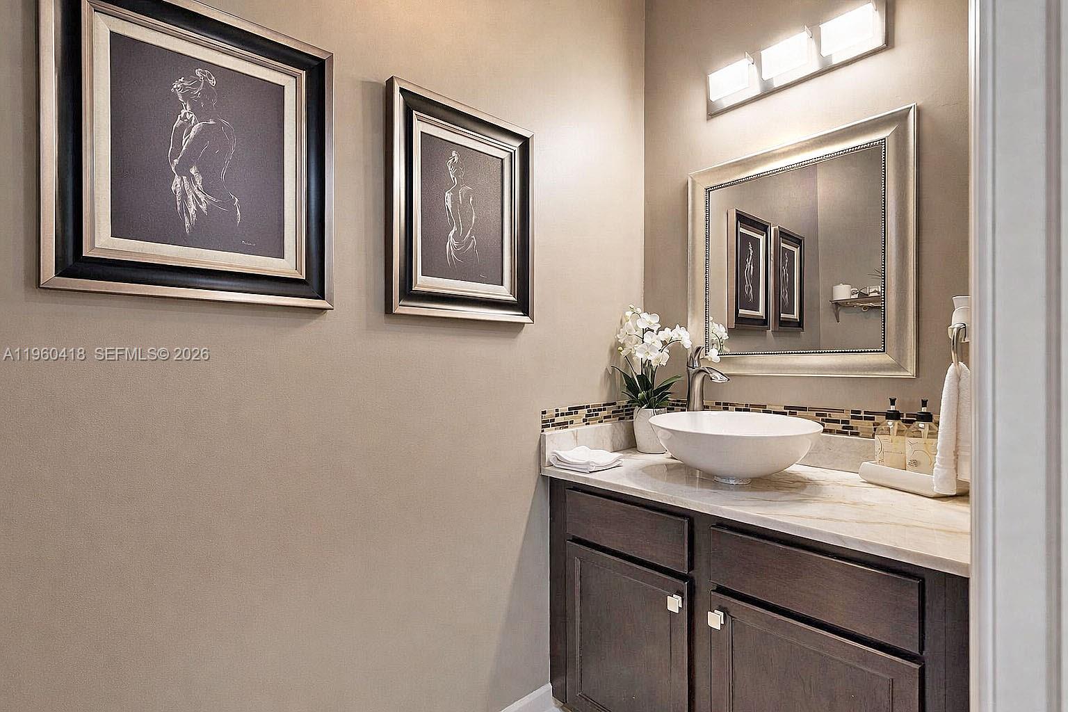 132 Northeast 26th Avenue Homestead, FL 33033 - Photo 26 of 68 a bathroom with a sink and two mirror