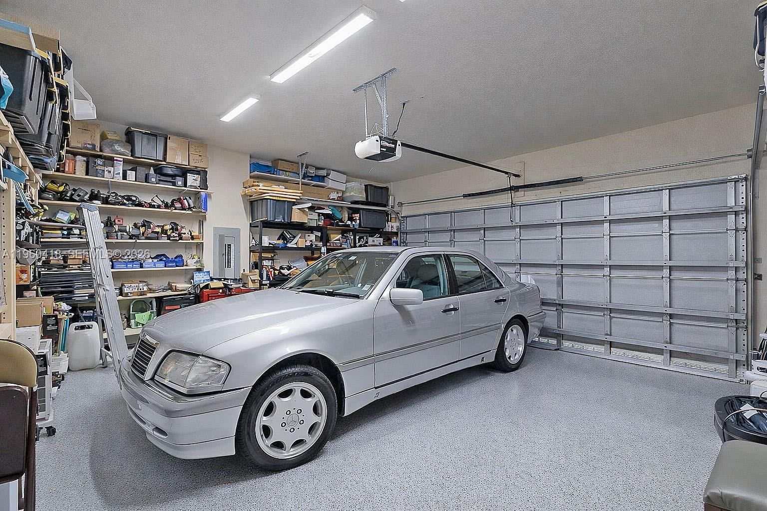 132 Northeast 26th Avenue Homestead, FL 33033 - Photo 27 of 68 a view of parking garage with cars