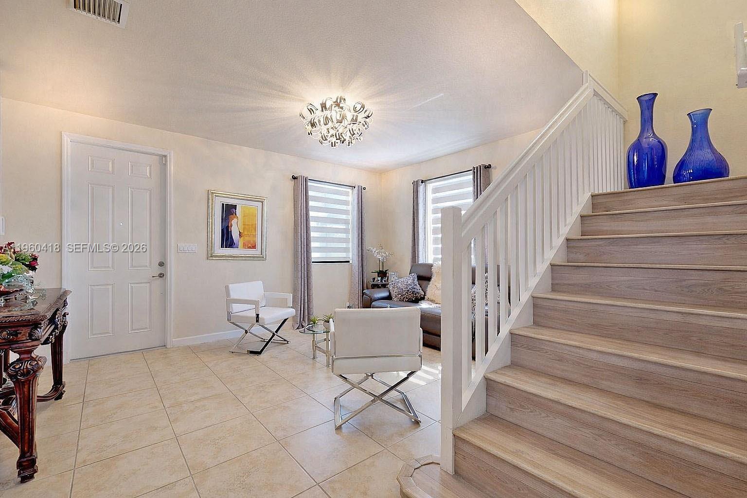 132 Northeast 26th Avenue Homestead, FL 33033 - Photo 28 of 68 a view of entryway and hall with wooden floor