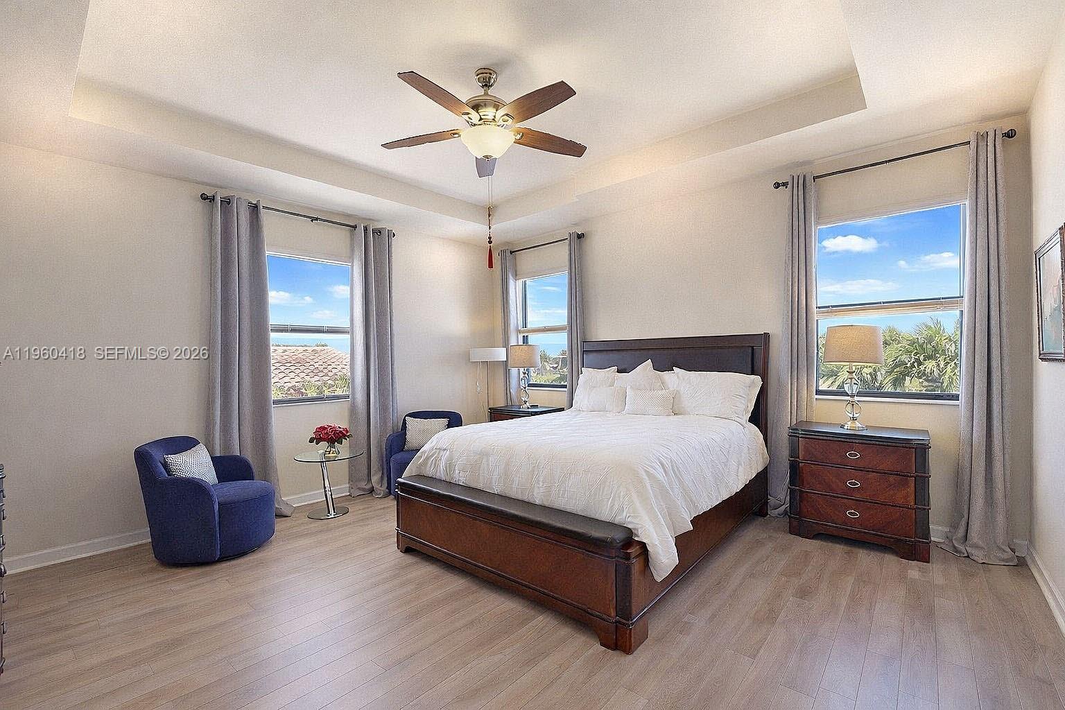 132 Northeast 26th Avenue Homestead, FL 33033 - Photo 31 of 68 a spacious bedroom with a bed and a table