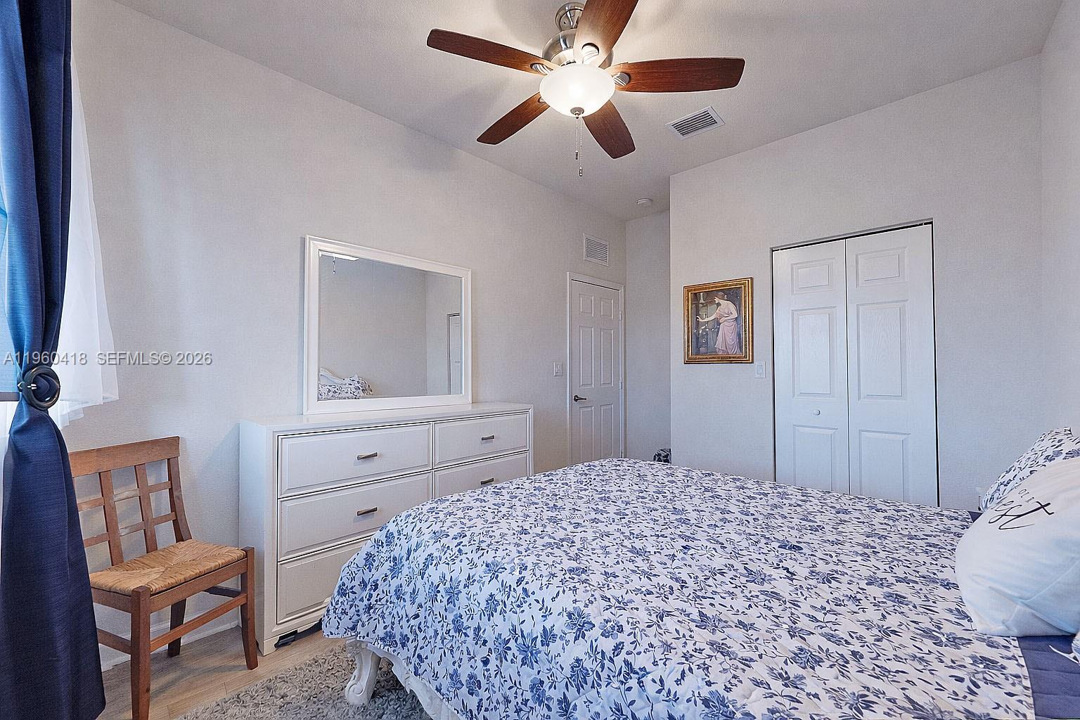 132 Northeast 26th Avenue Homestead, FL 33033 - Photo 45 of 68 a bedroom with a bed and a dresser