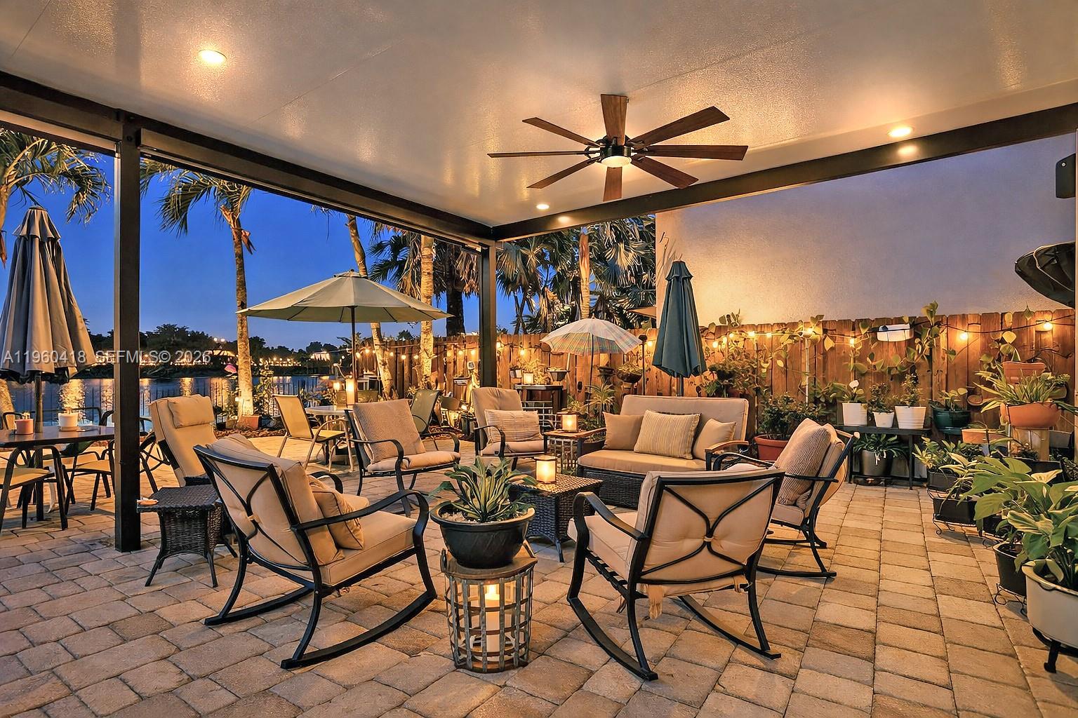 132 Northeast 26th Avenue Homestead, FL 33033 - Photo 48 of 68 a dining room with furniture and a floor to ceiling window