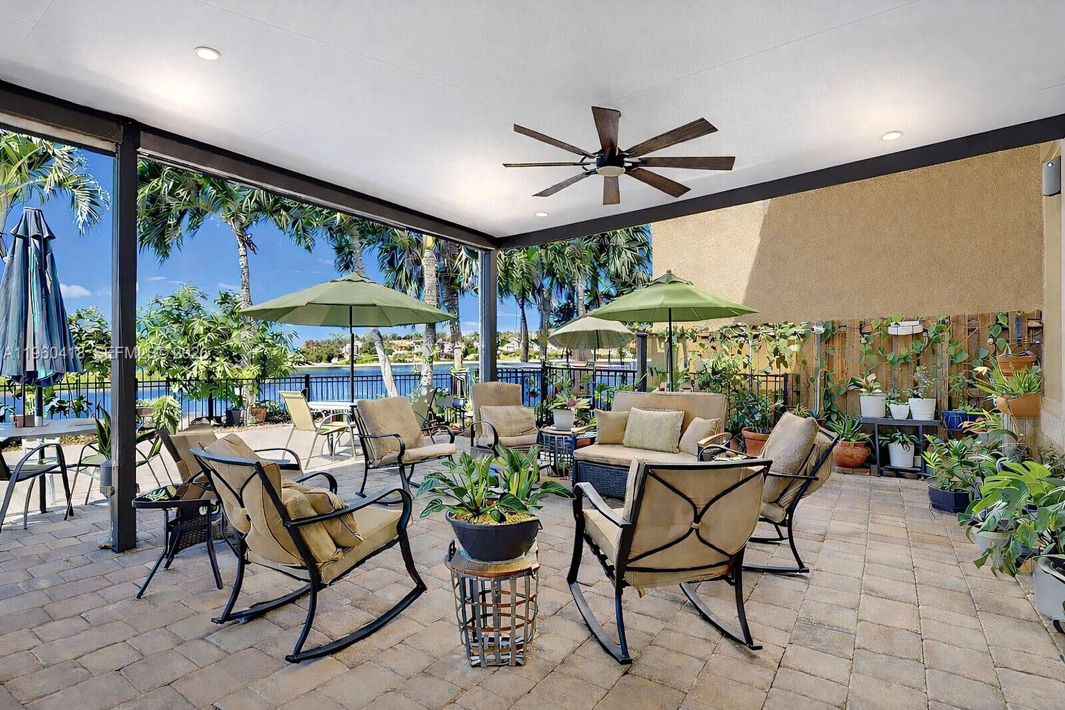 132 Northeast 26th Avenue Homestead, FL 33033 - Photo 55 of 68 a dining room with furniture and a potted plant