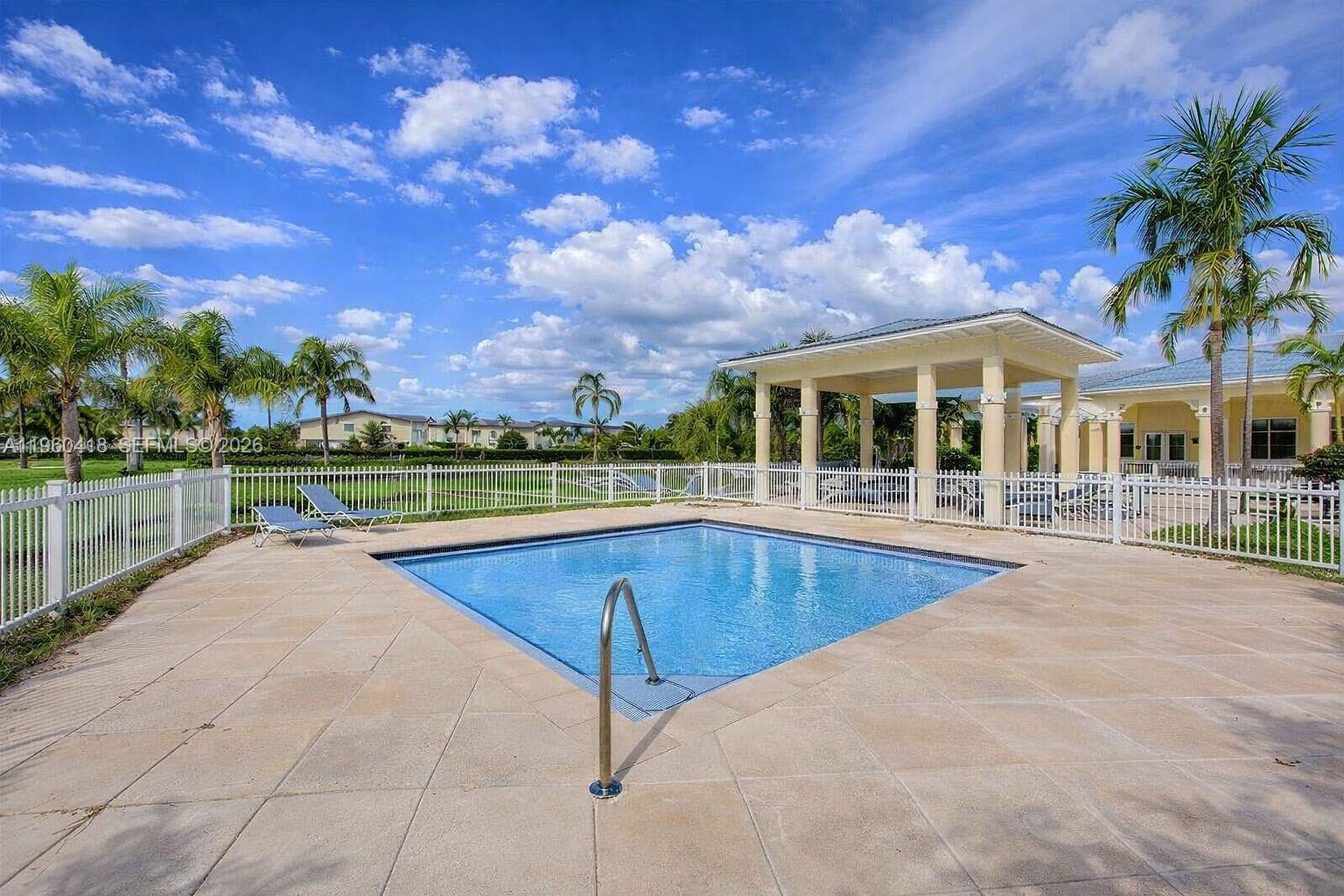132 Northeast 26th Avenue Homestead, FL 33033 - Photo 66 of 68 a view of a house with pool and a yard
