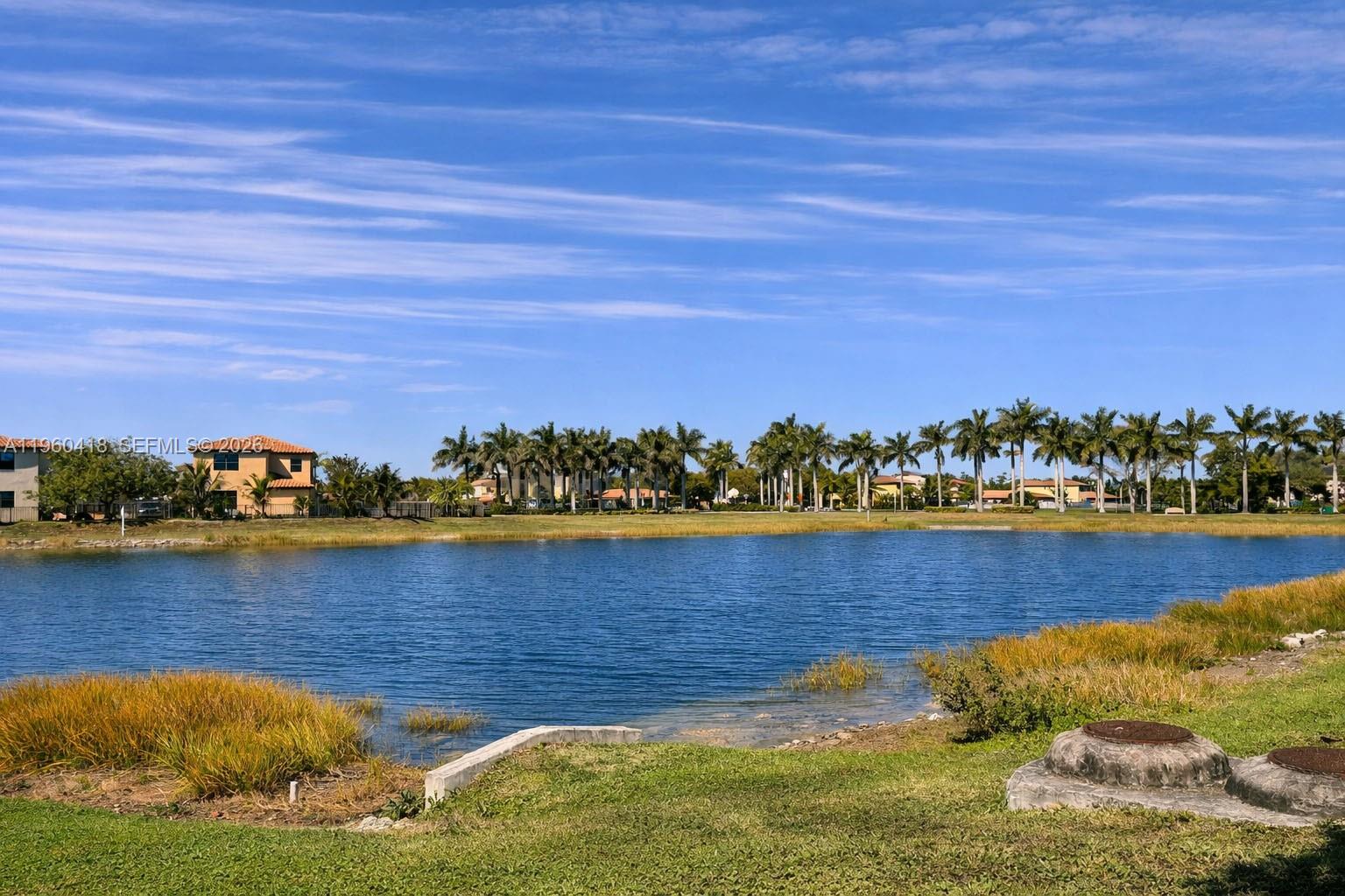 132 Northeast 26th Avenue Homestead, FL 33033 - Photo 7 of 68 a view of a lake with houses