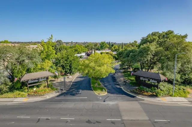an aerial view of a house with outdoor space