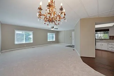 a kitchen with a stove and a wooden floors