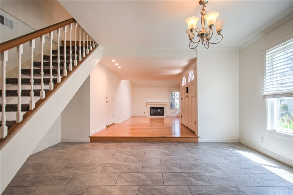 13 Brookmont, Unit 60 Irvine, CA 92604 - Photo 11 of 49 a view of entryway and hall with wooden floor