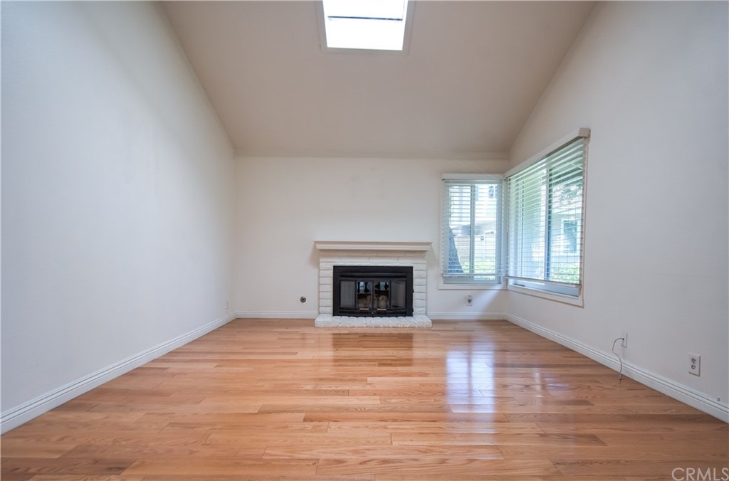 13 Brookmont, Unit 60 Irvine, CA 92604 - Photo 12 of 49 a view of an empty room with a window and fireplace