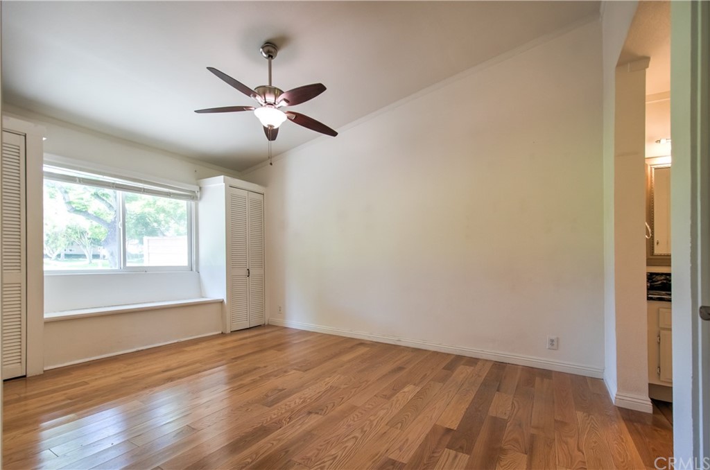 13 Brookmont, Unit 60 Irvine, CA 92604 - Photo 19 of 49 wooden floor in an empty room with a window