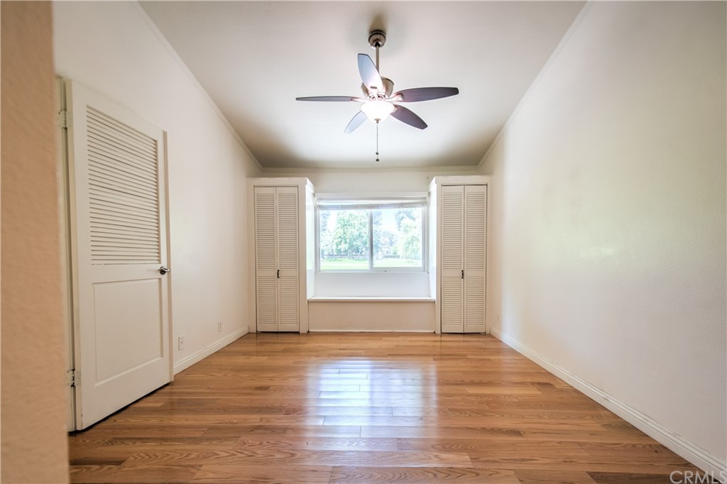 13 Brookmont, Unit 60 Irvine, CA 92604 - Photo 20 of 49 a view of an empty room with wooden floor and a window