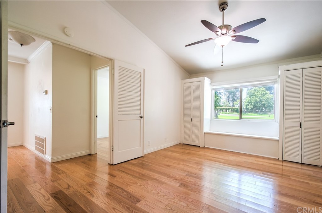 13 Brookmont, Unit 60 Irvine, CA 92604 - Photo 21 of 49 a view of an empty room with wooden floor and a window