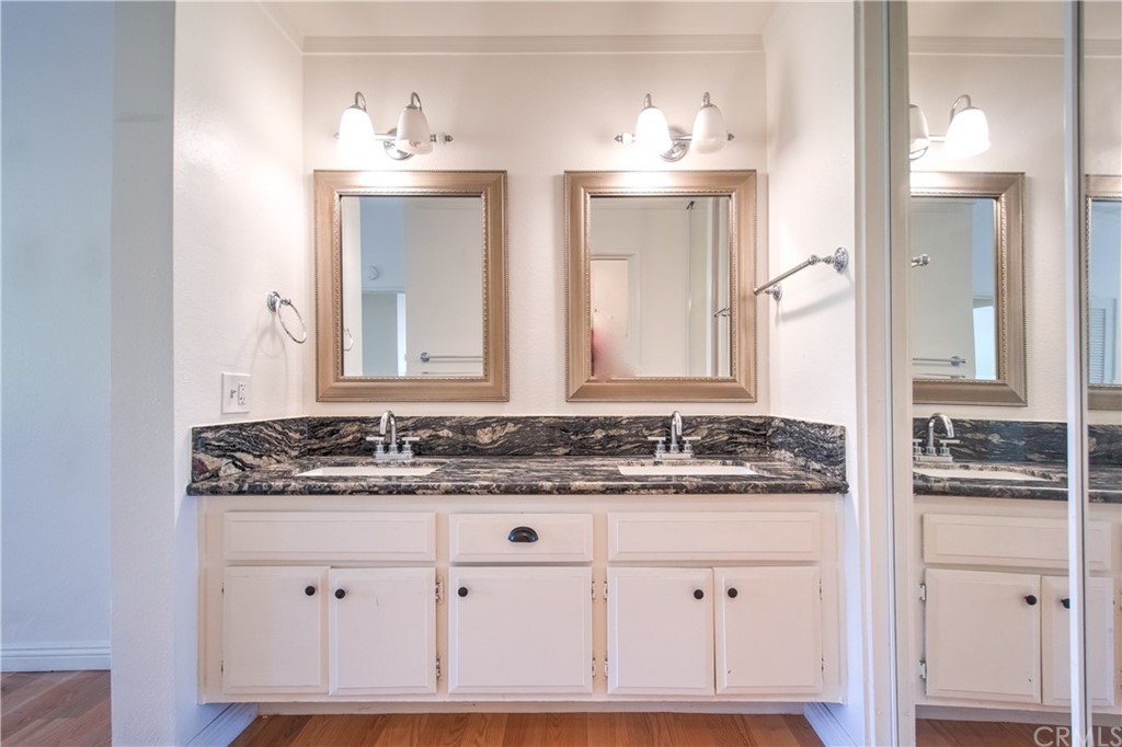 13 Brookmont, Unit 60 Irvine, CA 92604 - Photo 26 of 49 a bathroom with a sink and a mirror