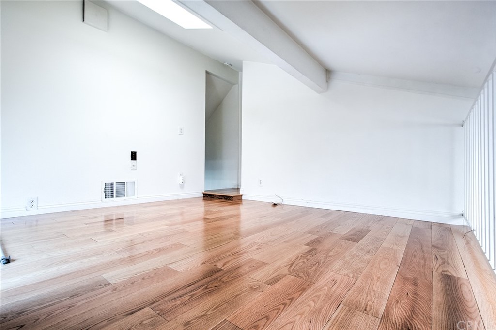 13 Brookmont, Unit 60 Irvine, CA 92604 - Photo 31 of 49 a view of an empty room and wooden floor