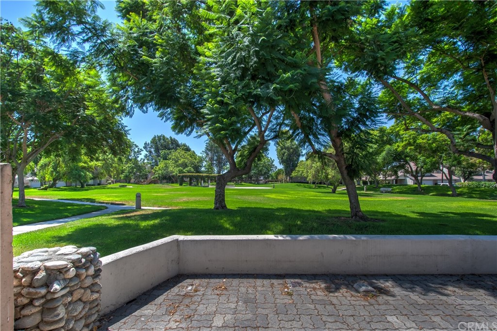 13 Brookmont, Unit 60 Irvine, CA 92604 - Photo 33 of 49 a view of backyard with swimming pool and green space