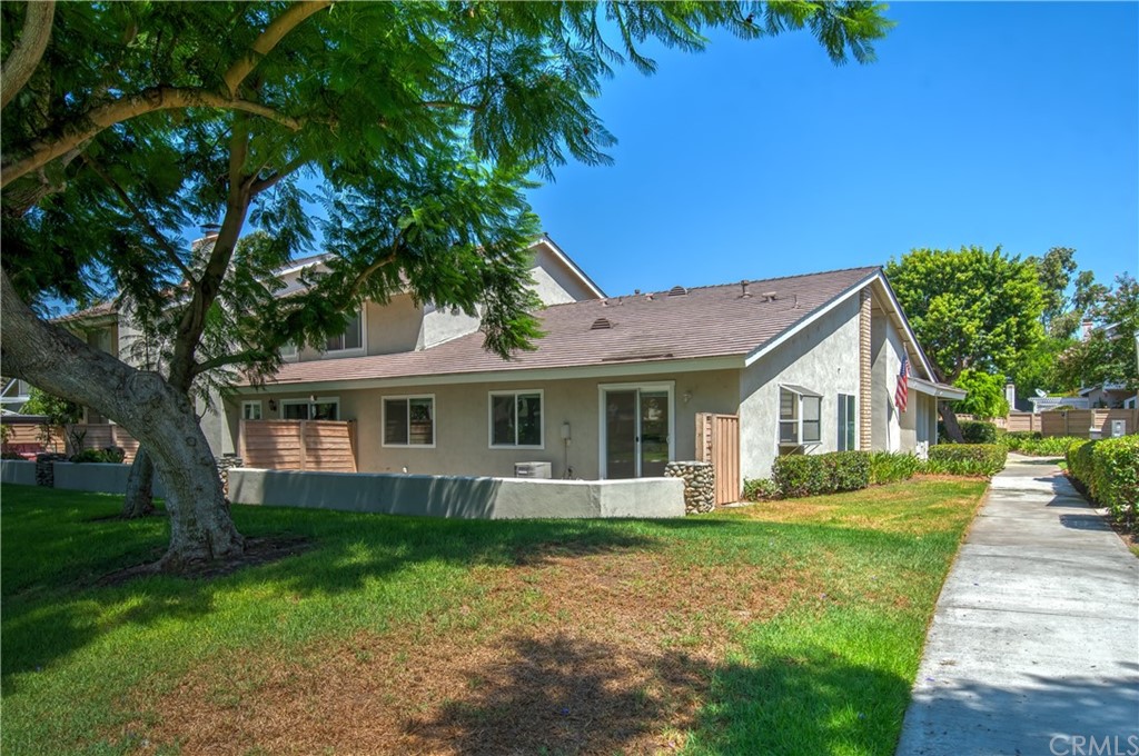 13 Brookmont, Unit 60 Irvine, CA 92604 - Photo 37 of 49 a front view of house with yard and green space