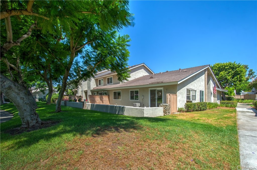 13 Brookmont, Unit 60 Irvine, CA 92604 - Photo 38 of 49 a front view of house with yard and green space
