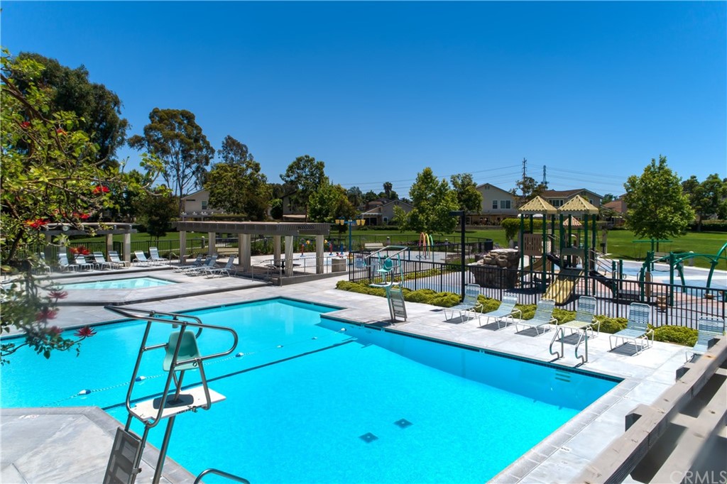 13 Brookmont, Unit 60 Irvine, CA 92604 - Photo 47 of 49 a view of a swimming pool with lounge chairs