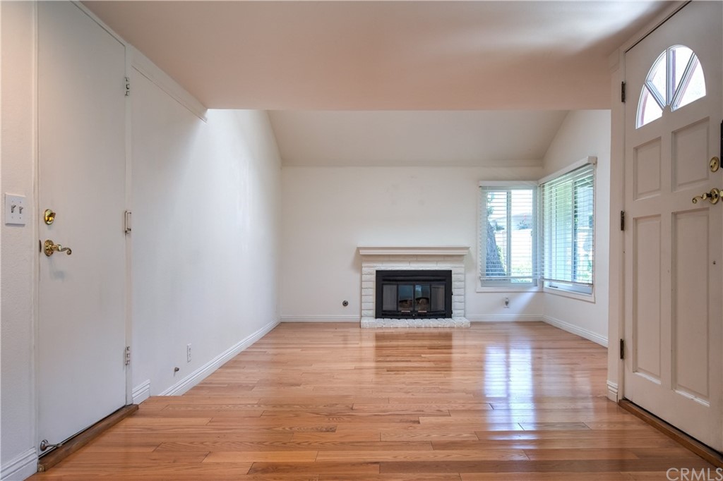 13 Brookmont, Unit 60 Irvine, CA 92604 - Photo 7 of 49 a view of empty room with wooden floor and a window