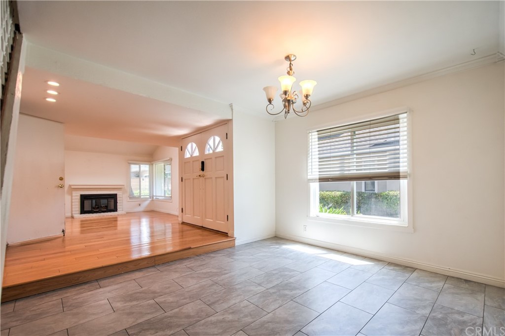 13 Brookmont, Unit 60 Irvine, CA 92604 - Photo 9 of 49 an empty room with chandelier fan and windows