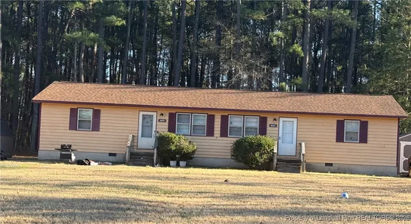 a view of a house with a plants and trees