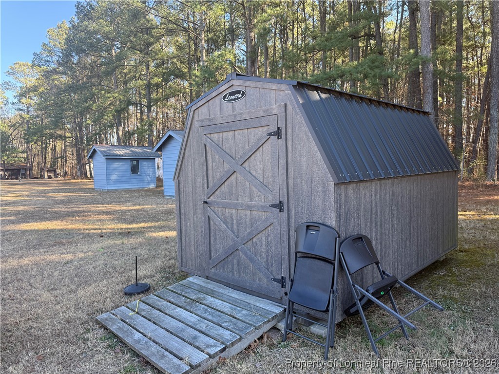 1203 West C Street Butner, NC 27509 - Photo 5 of 5 a backyard of a house with table and chairs