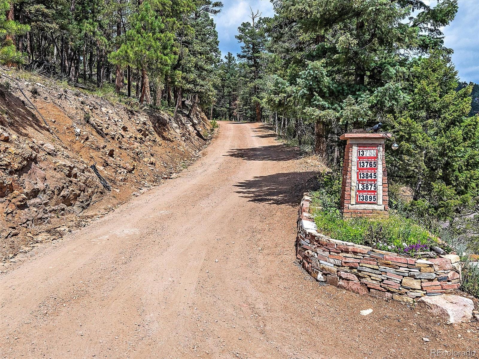 13745 Shiloh Drive Conifer, CO 80433 - Photo 12 of 20 a view of a yard with potted plants