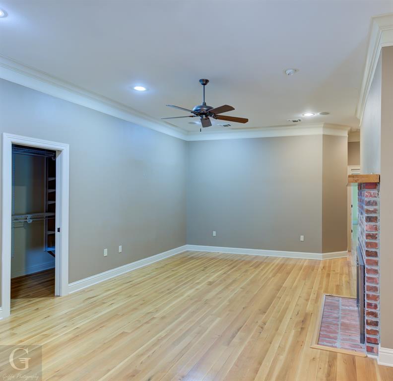 1212 WPA Road Homer, LA 71040 - Photo 20 of 35 Unfurnished living room featuring ornamental molding, a ceiling fan, light wood-style flooring, baseboards, and recessed lighting
