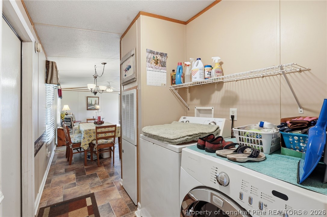 10400 Ruth Vinson Road Autryville, NC 28318 - Photo 49 of 49 a room with storage and utility
