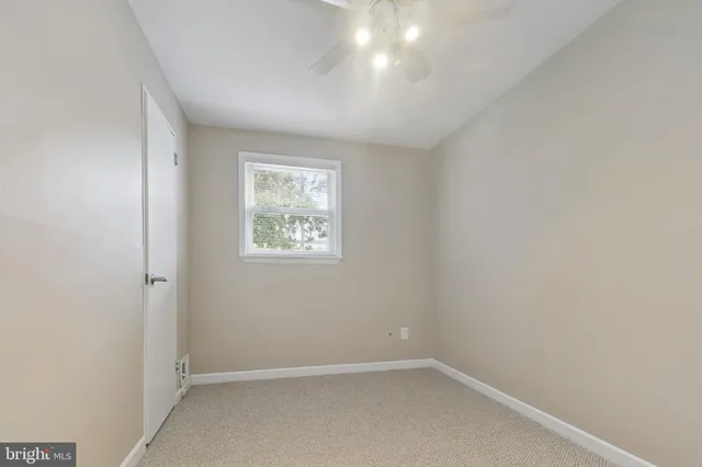 an empty room with a empty space and window