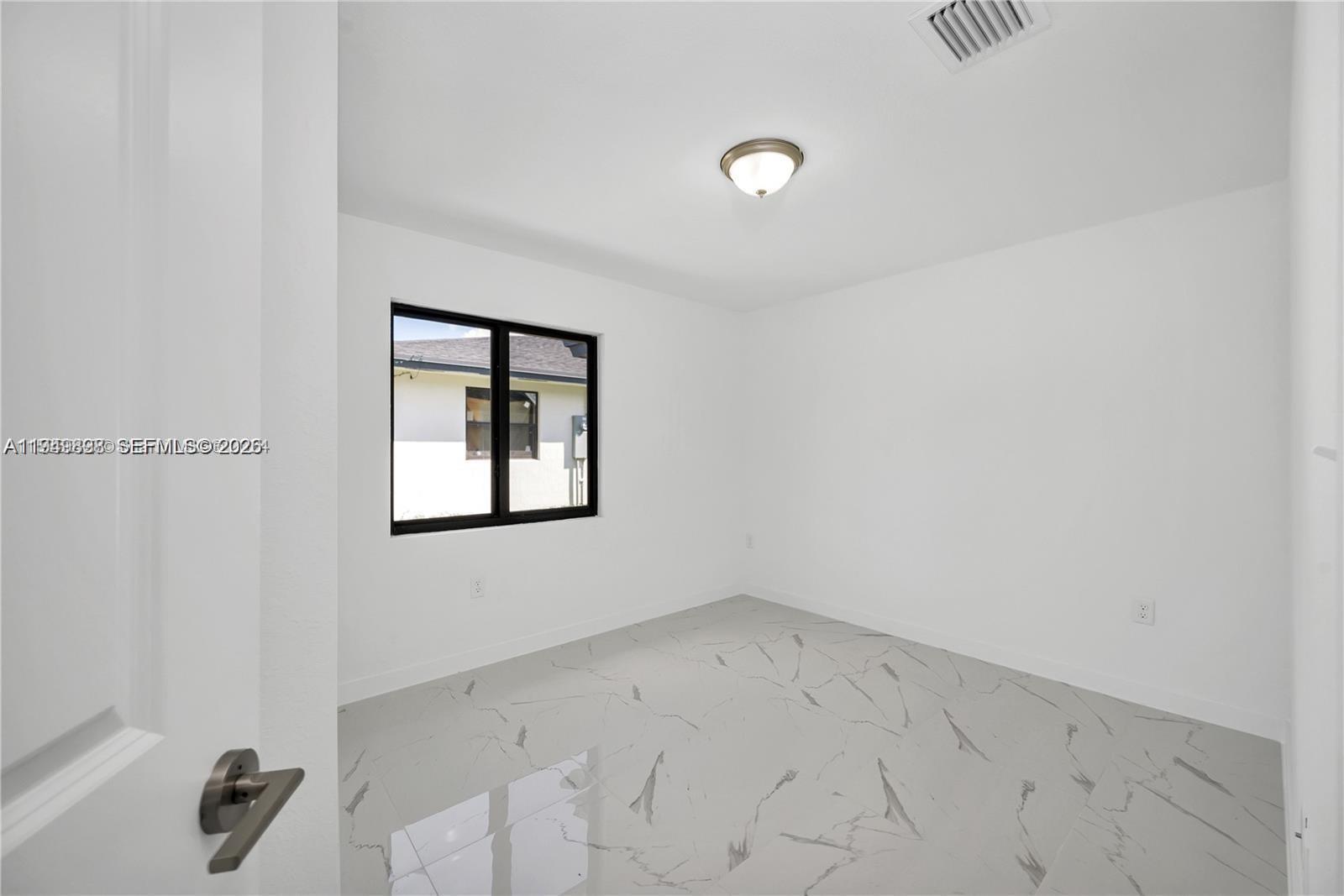 673 Northwest 14th Street, Unit 1 Florida City, FL 33034 - Photo 11 of 21 a view of an empty room