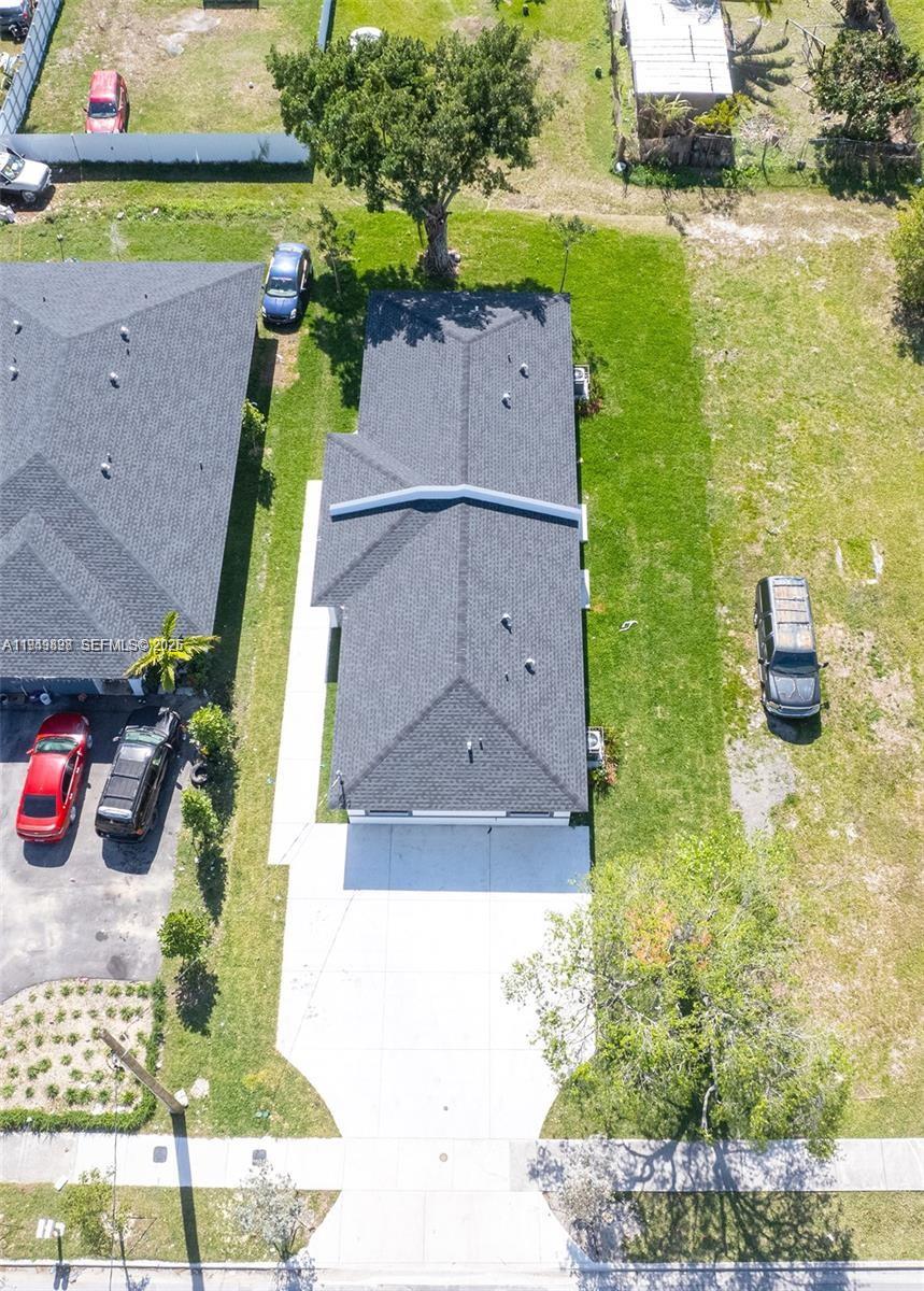 673 Northwest 14th Street, Unit 1 Florida City, FL 33034 - Photo 16 of 21 an aerial view of a house with a yard and a fountain