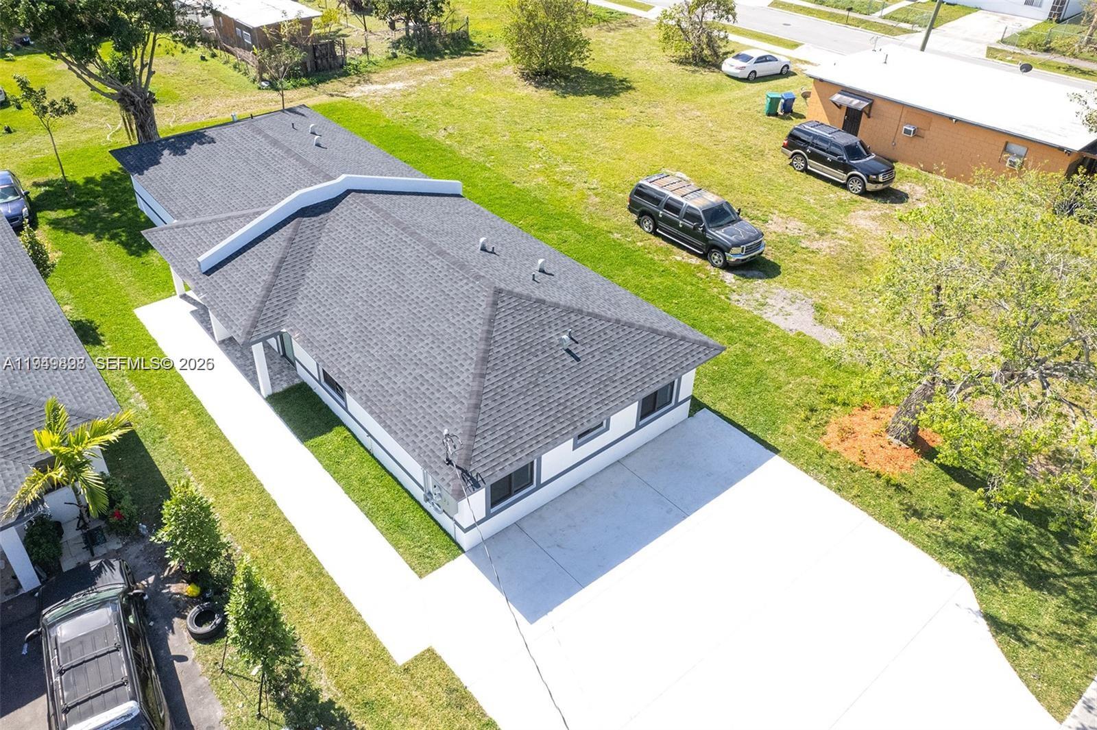673 Northwest 14th Street, Unit 1 Florida City, FL 33034 - Photo 17 of 21 a view of a yard with an outdoor space