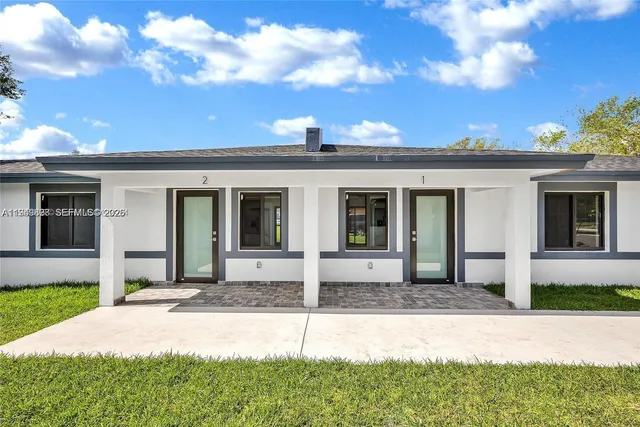 a patio with table and chairs
