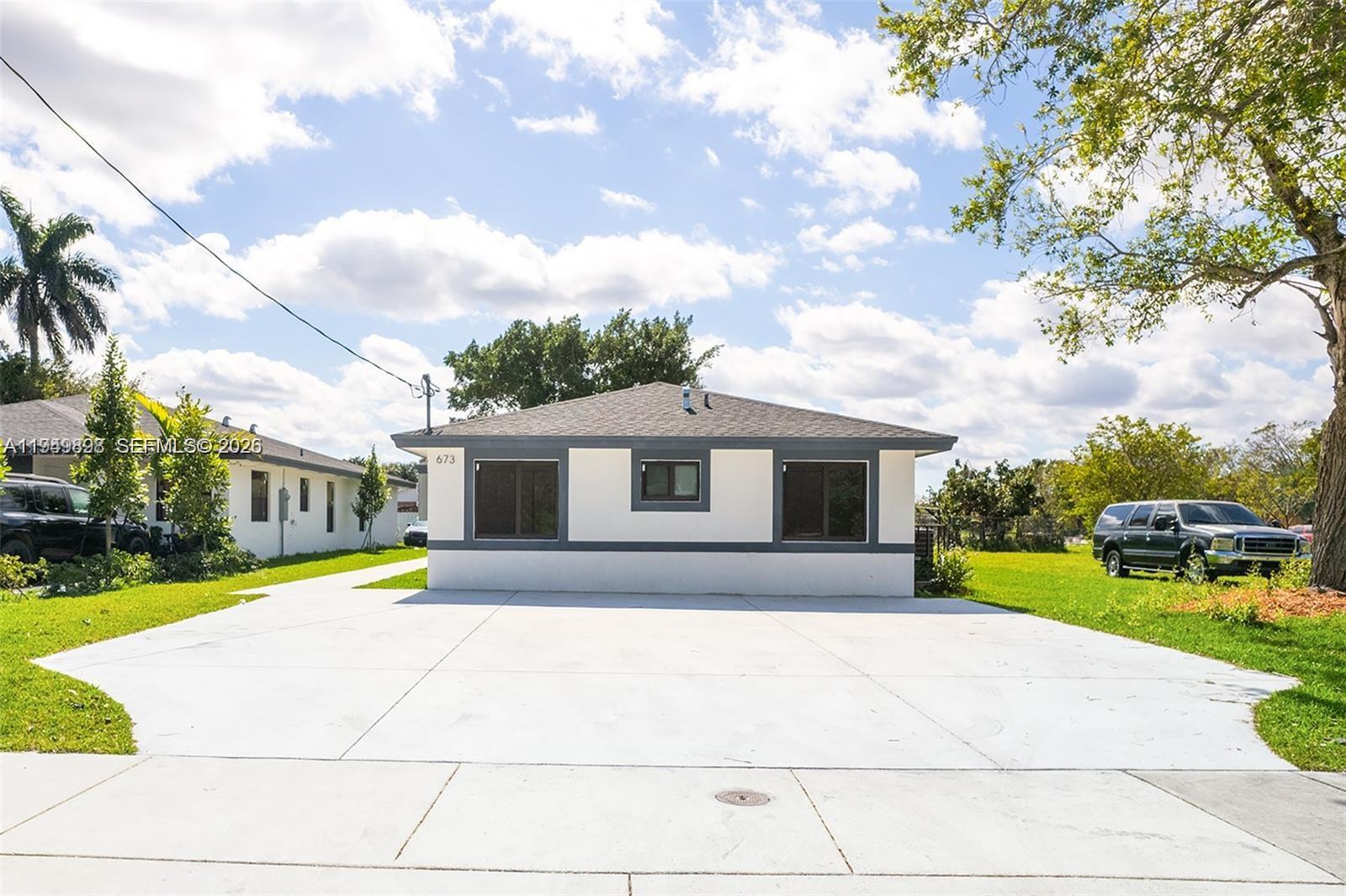 673 Northwest 14th Street, Unit 1 Florida City, FL 33034 - Photo 21 of 21 a view of a house with a yard